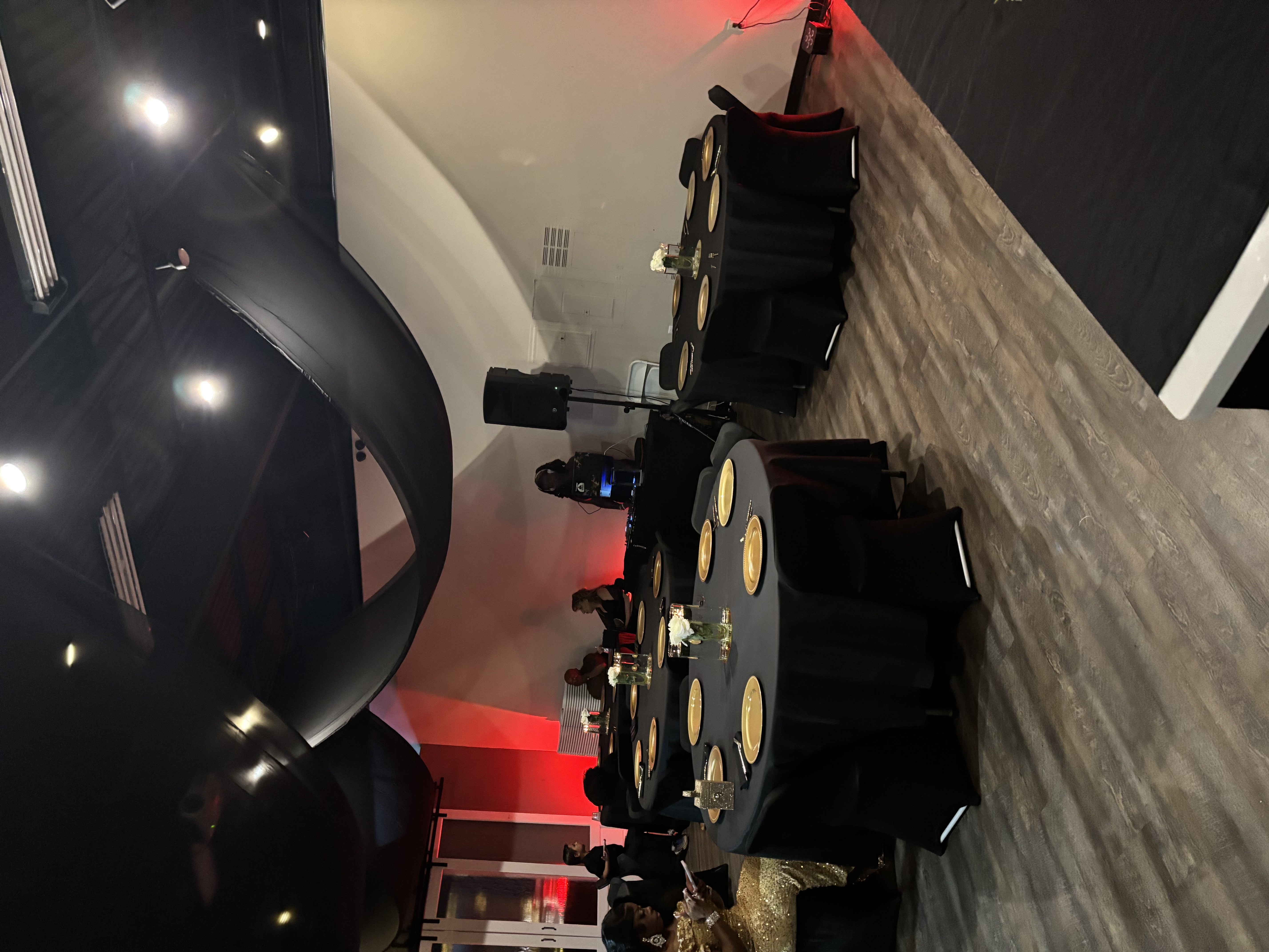 Elegant private dinner event setup with gold chargers and ambient lighting at Brown Rice Consortium Denver